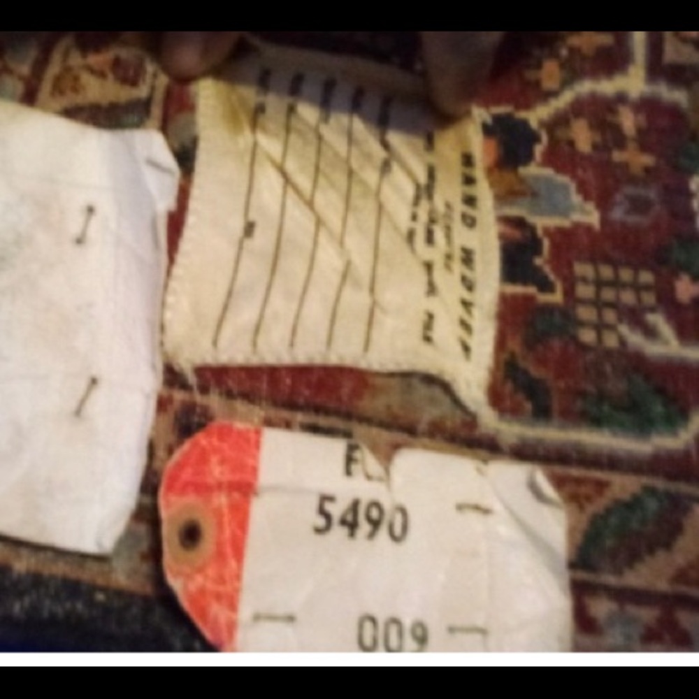 Brand new Persian rug. Tags still attached, approximately 45 years old
